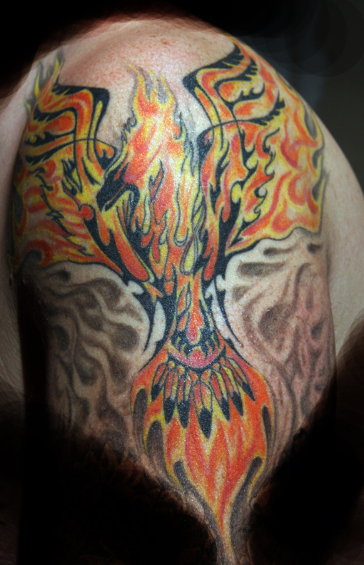 Large tattoo of Phoenix on upper arm